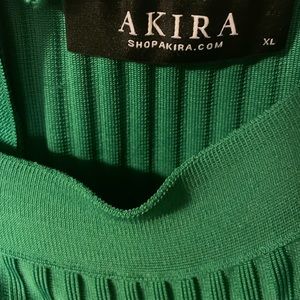 Versatile hunter green pleated skirt.